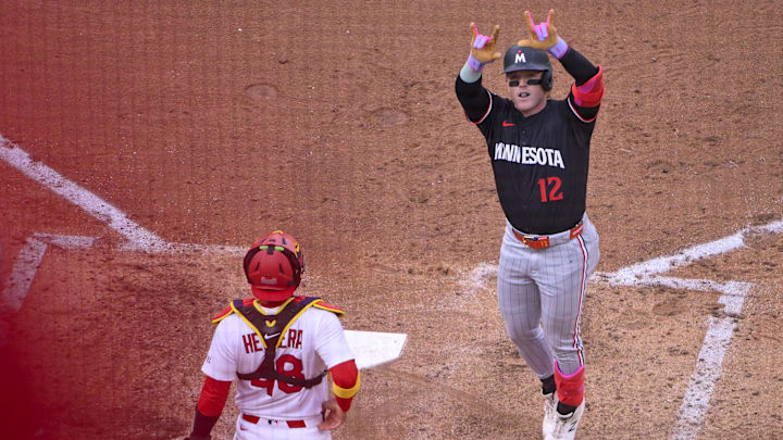 Mar 27, 2025; St. Louis, Missouri, USA;  Minnesota Twins left fielder Harrison Bader (12) reacts after hitting a two run home run against the St. Louis Cardinals during the fifth inning at Busch Stadium.
