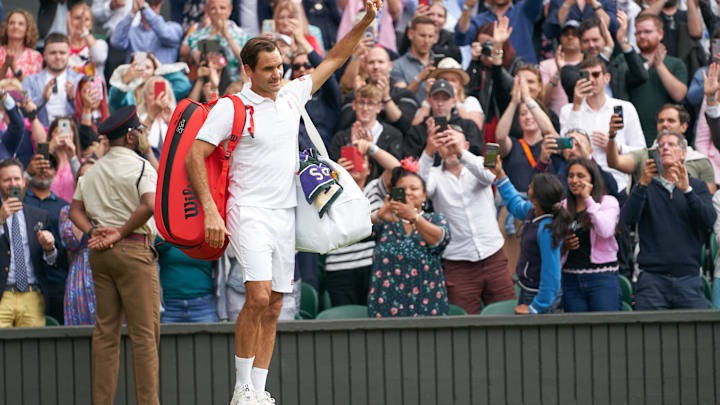 Jul 7, 2021; London, United Kingdom; Roger Federer (SUI) waving farewell to the Centre Court fans after losing to Hubert Hurkacz (POL) in the quarter finals at All England Lawn Tennis and Croquet Club. Mandatory Credit: Peter van den Berg-Imagn Images