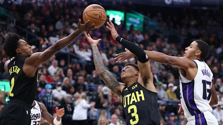 Oct 29, 2024; Salt Lake City, Utah, USA; Utah Jazz guard Collin Sexton (2) and guard Keyonte George (3) battle Sacramento Kings forward Keegan Murray (13) for a rebound during the first quarter at Delta Center. Mandatory Credit: Rob Gray-Imagn Images