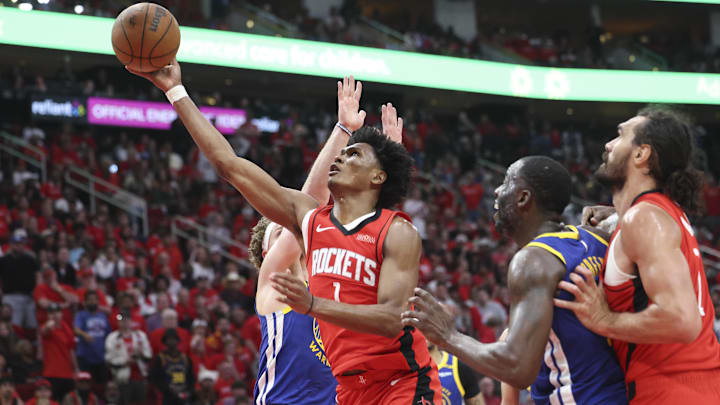 Apr 20, 2025; Houston, Texas, USA; Houston Rockets forward Amen Thompson (1) shoots the ball during the fourth quarter against the Golden State Warriors at Toyota Center. Mandatory Credit: Troy Taormina-Imagn Images