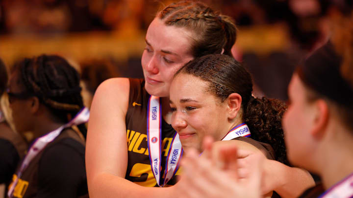 Kickapoo's Allison Scott (32) hugs Kya Johnson (33) after receiving second place medals following a Class 6 state championship girls basketball game between Kickapoo and Incarnate Word, Saturday, March 16, 2024, at Mizzou Arena in Columbia, Mo.