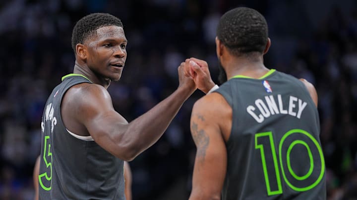 Mar 24, 2024; Minneapolis, Minnesota, USA; Minnesota Timberwolves guard Anthony Edwards (5) and