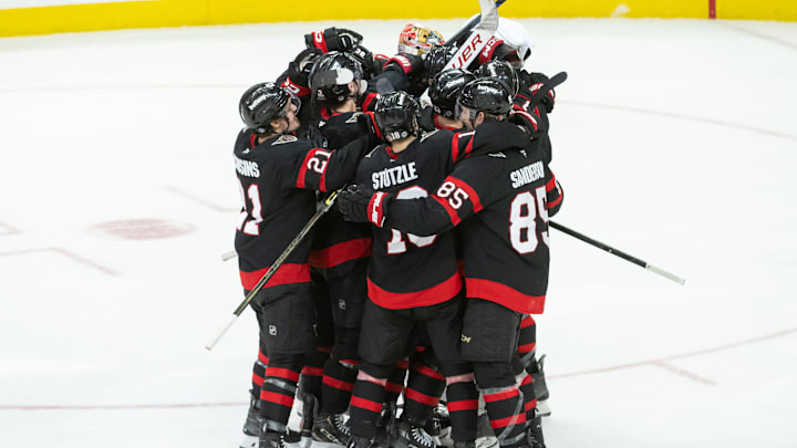 Dec 14, 2024; Ottawa, Ontario, CAN; The Ottawa Senators celebrate their win in overtime against the Pittsburgh Penguins at the Canadian Tire Centre. Mandatory Credit: Marc DesRosiers-Imagn Images Dec 14, 2024; Ottawa, Ontario, CAN; The Ottawa Senators celebrate their win in overtime against the Pittsburgh Penguins at the Canadian Tire Centre. Mandatory Credit: Marc DesRosiers-Imagn Images