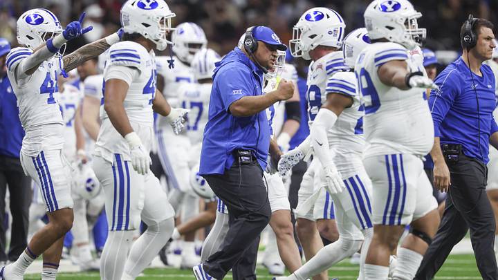 Dec 28, 2024; San Antonio, TX, USA; Brigham Young Cougars head coach Kalani Sitake reacts after a play during the second quarter against the Colorado Buffaloes at Alamodome. Mandatory Credit: Troy Taormina-Imagn Images Dec 28, 2024; San Antonio, TX, USA; Brigham Young Cougars head coach Kalani Sitake reacts after a play during the second quarter against the Colorado Buffaloes at Alamodome. Mandatory Credit: Troy Taormina-Imagn Images