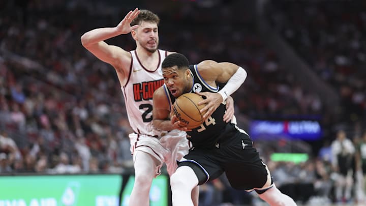 Feb 25, 2025; Houston, Texas, USA; Milwaukee Bucks forward Giannis Antetokounmpo (34) drives with the ball as Houston Rockets center Alperen Sengun (28) defends during the fourth quarter at Toyota Center. Mandatory Credit: Troy Taormina-Imagn Images