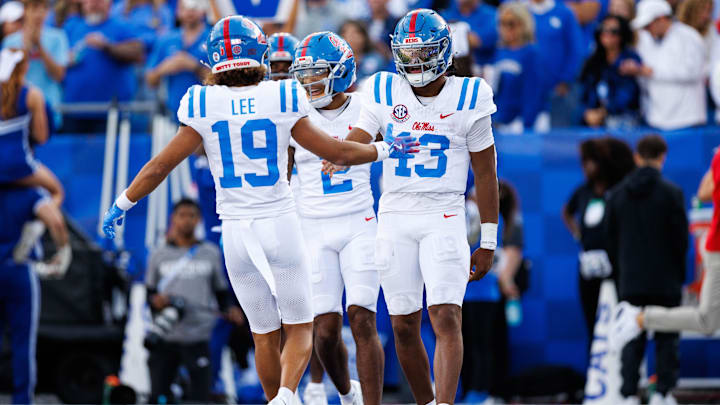 Sep 6, 2025; Lexington, Kentucky, USA; Mississippi Rebels quarterback Austin Simmons (13) celebrates with wide receiver Cayden Lee (19) after scoring a touchdown during the third quarter against the Kentucky Wildcats at Kroger Field. Mandatory Credit: Jordan Prather-Imagn Images