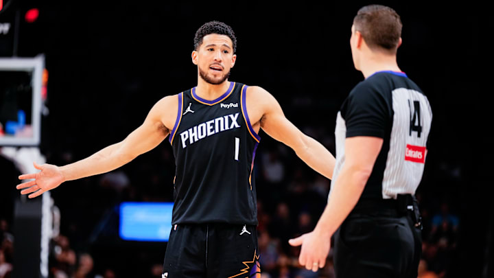 Feb 10, 2026; Phoenix, Arizona, USA; Phoenix Suns guard Devin Booker (1) questions a ref in the second half of the game against the Dallas Mavericks at Mortgage Matchup Center. Mandatory Credit: Arianna Grainey-Imagn Images