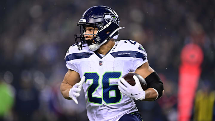 Dec 26, 2024; Chicago, Illinois, USA; Seattle Seahawks running back Zach Charbonnet (26) runs the ball against the Chicago Bears during the first quarter at Soldier Field. Mandatory Credit: Daniel Bartel-Imagn Images Dec 26, 2024; Chicago, Illinois, USA; Seattle Seahawks running back Zach Charbonnet (26) runs the ball against the Chicago Bears during the first quarter at Soldier Field. Mandatory Credit: Daniel Bartel-Imagn Images