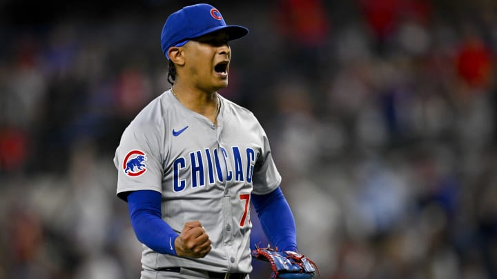 Mar 31, 2024; Arlington, Texas, USA; Chicago Cubs relief pitcher Adbert Alzolay (73) celebrates after the Cubs defeat the Texas Rangers at Globe Life Field.