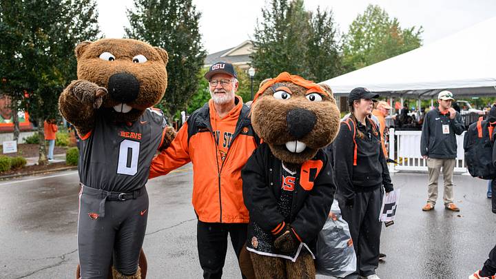Oct 11, 2025; Corvallis, Oregon, USA; Oregon State Beavers fan poses with the mascots Benny and Bernice outside Reser Stadium before the game against the Wake Forest Demon Deacons. Mandatory Credit: Craig Strobeck-Imagn Images Oct 11, 2025; Corvallis, Oregon, USA; Oregon State Beavers fan poses with the mascots Benny and Bernice outside Reser Stadium before the game against the Wake Forest Demon Deacons. Mandatory Credit: Craig Strobeck-Imagn Images