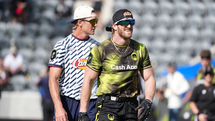 Mar 21, 2026; Los Angeles, CA, USA; Founders FFC quarterback Tom Brady and Logan Paul of Wildcats FFC react during the Fanatics Flag Football Classic at BMO stadium. Mandatory Credit: Kirby Lee-Imagn Images