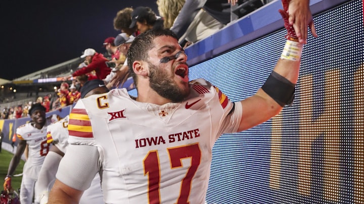 Oct 12, 2024; Morgantown, West Virginia, USA; Iowa State Cyclones defensive back Beau Freyler (17) celebrates with fans after defeating the West Virginia Mountaineers at Mountaineer Field at Milan Puskar Stadium. Mandatory Credit: Ben Queen-Imagn Images