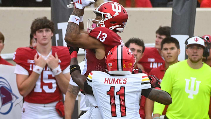 Sep 28, 2024; Bloomington, Indiana, USA; Indiana Hoosiers wide receiver Elijah Sarratt (13) catches a pass against Maryland Terrapins defensive back Kevyn Humes (11) during the first half at Memorial Stadium. Mandatory Credit: Robert Goddin-Imagn Images