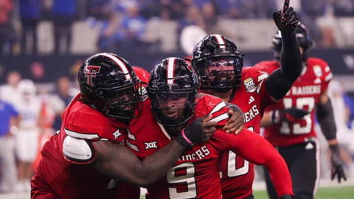 Texas Tech players Lee Hunter (left) and Jacob Rodriguez (back). 