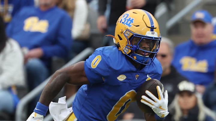 Oct 25, 2025; Pittsburgh, Pennsylvania, USA;  Pittsburgh Panthers running back Desmond Reid (0) carries the ball against the North Carolina State Wolfpack during the second quarter at Acrisure Stadium. Mandatory Credit: Charles LeClaire-Imagn Images