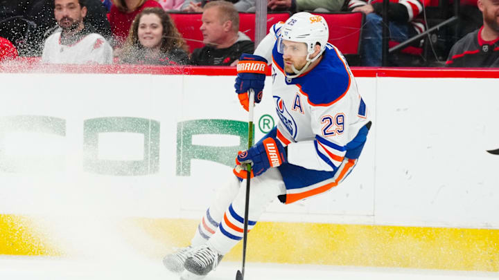 Mar 1, 2025; Raleigh, North Carolina, USA;  Edmonton Oilers center Leon Draisaitl (29) skates with the puck against the Carolina Hurricanes during the first period at Lenovo Center. Mandatory Credit: James Guillory-Imagn Images