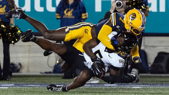 Cal defensive back Daniel Harris (7) brings down Wake Forest wide receiver Kam Shanks Cal defensive back Daniel Harris (7) brings down Wake Forest wide receiver Kam Shanks
