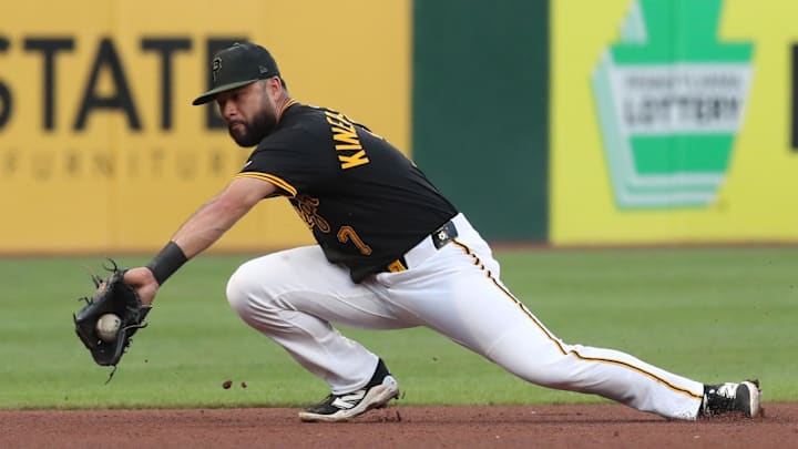 Aug 4, 2025; Pittsburgh, Pennsylvania, USA;  Pittsburgh Pirates third baseman Isiah Kiner-Falefa (7) fields a ground ball hit for a single by San Francisco Giants left fielder Heliot Ramos (not pictured) during the fourth inning at PNC Park. Mandatory Credit: Charles LeClaire-Imagn Images