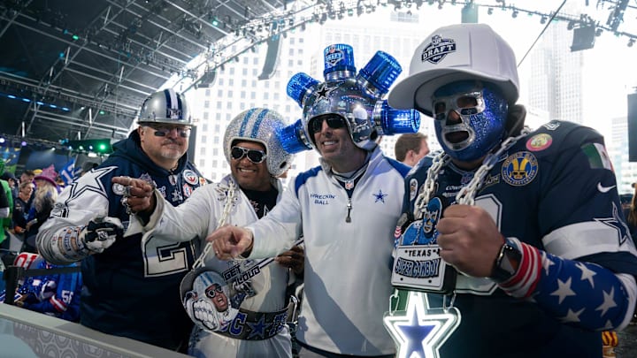 Dallas Cowboys fans pose in the main theater on Thursday, April 25, 2024 for the first day of the NFL Draft in Detroit.