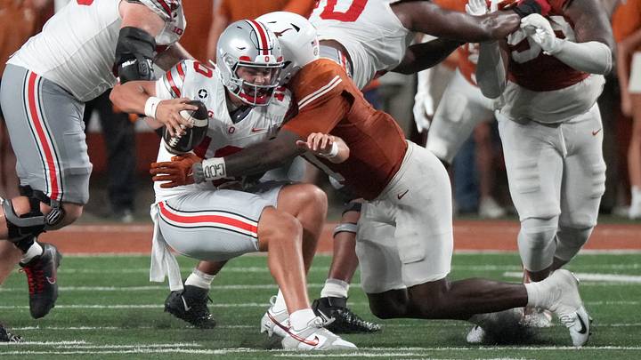 Texas Longhorns defensive end Colin Simmons (1) sacks Ohio State Buckeyes quarterback Julian Sayin (10) during the first half at Darrell K Royal-Texas Memorial Stadium. Texas Longhorns defensive end Colin Simmons (1) sacks Ohio State Buckeyes quarterback Julian Sayin (10) during the first half at Darrell K Royal-Texas Memorial Stadium.