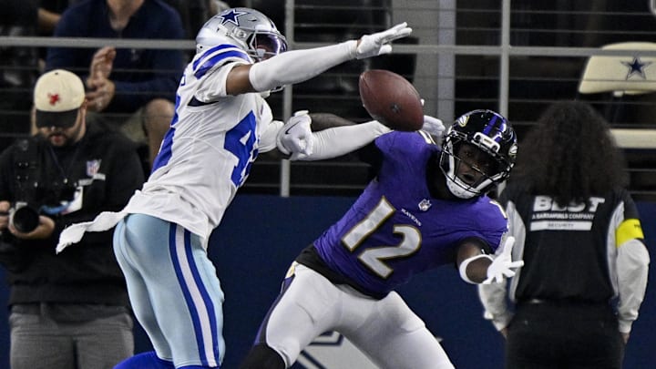 Dallas Cowboys cornerback Zion Childress breaks up a pass intended for Baltimore Ravens wide receiver Malik Cunningham.
