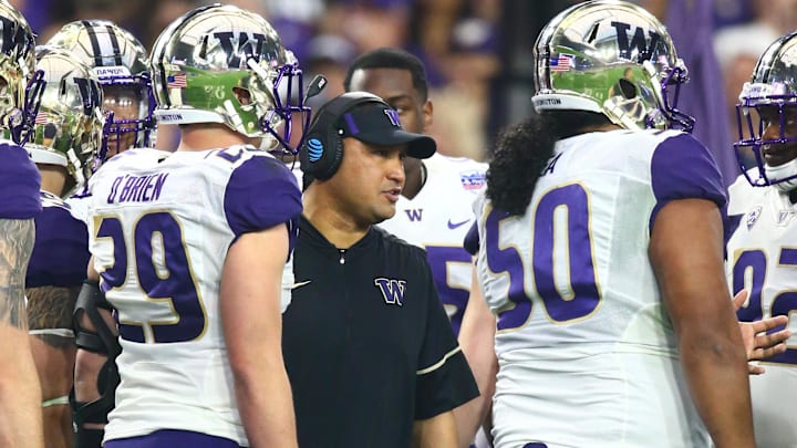 Ikaika Malloe is shown coaching for the UW against Penn State in the 2017 Fiesta Bowl.