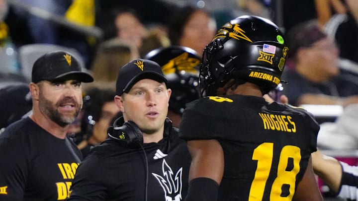 Arizona State head coach Kenny Dillingham greets linebacker Martell Hughes (18) during a game at Mountain America Stadium in Tempe on Sept. 26, 2025.