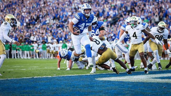 BYU quarterback Bear Bachmeier scores a touchdown against Notre Dame BYU quarterback Bear Bachmeier scores a touchdown against Notre Dame