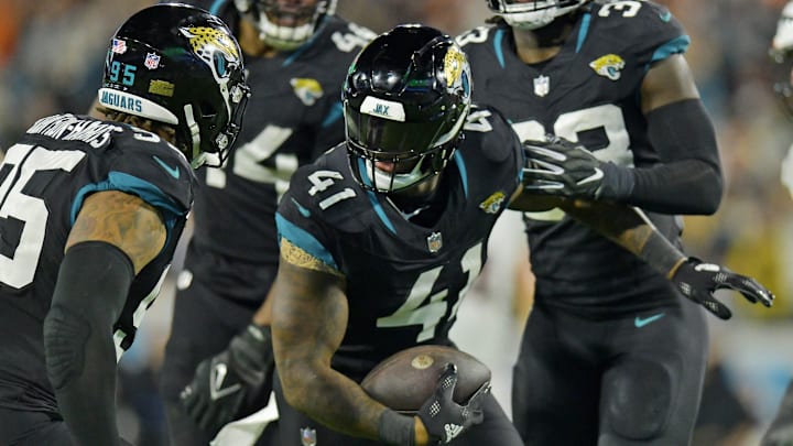 Jacksonville Jaguars linebacker Josh Allen (41) celebrates with teammates after interception a
