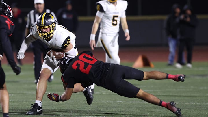 Ventura's Tristan Phillips is tackled by Rio Mesa's Juan Munoz during the third quarter of the teams' CIF-SS Division 5 first-round game at Royal High on Friday, Nov. 8, 2024. Rio Mesa won, 21-18.