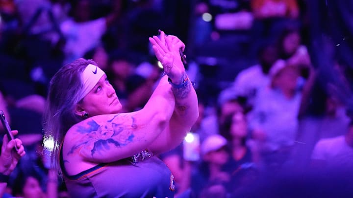 Mercury fans stand up to cheer during a timeout at a home game at PHX Arena on Aug. 28, 2025, in Phoenix.