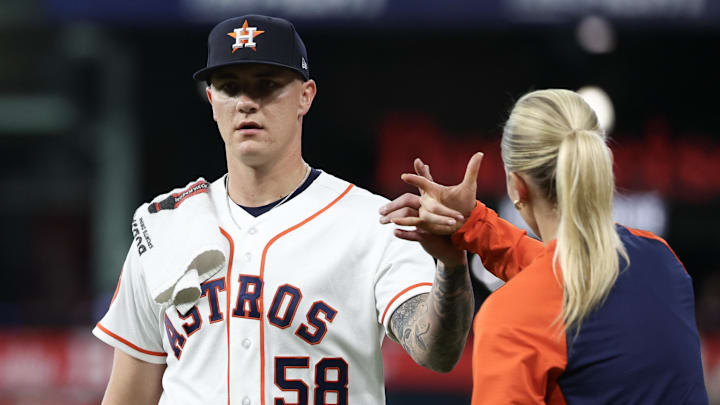 Houston Astros starting pitcher Hunter Brown (58) high fives trainer Stephanie Grubbs as he walks from the bullpen to the dugout before pitching against the Boston Red Sox at Daikin Park. Houston Astros starting pitcher Hunter Brown (58) high fives trainer Stephanie Grubbs as he walks from the bullpen to the dugout before pitching against the Boston Red Sox at Daikin Park.