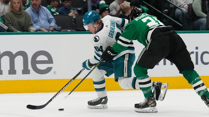 Mar 2, 2024; Dallas, Texas, USA;  San Jose Sharks center Mikael Granlund (64) skates with the puck