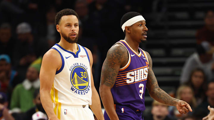 Golden State Warriors guard Stephen Curry (30) against Phoenix Suns guard Bradley Beal (3) at Footprint Center. Mandatory Credit: Mark J. Rebilas-Imagn Images
