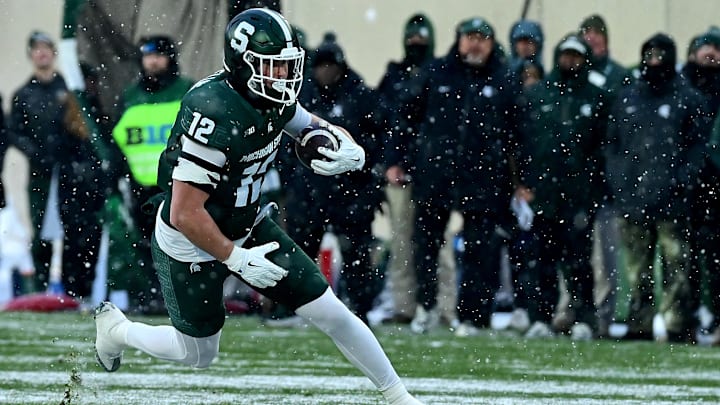 Nov 30, 2024; East Lansing, Michigan, USA;  Michigan State Spartans tight end Jack Velling (12) sprints upfield after catching a second quarter pass against the Rutgers Scarlet Knights at Spartan Stadium. Mandatory Credit: Dale Young-Imagn Images