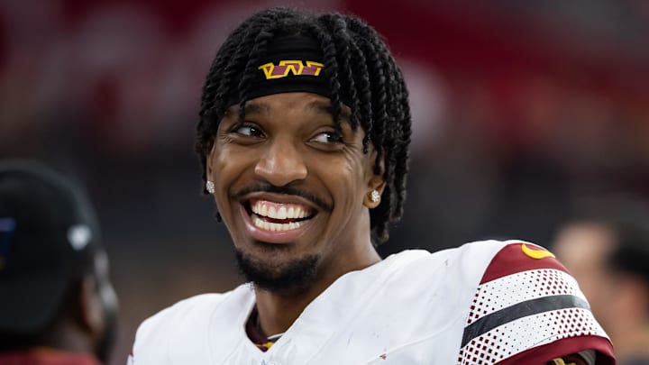 Sep 29, 2024; Glendale, Arizona, USA; Washington Commanders quarterback Jayden Daniels (5) against the Arizona Cardinals at State Farm Stadium. Mandatory Credit: Mark J. Rebilas-Imagn Images