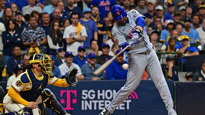 Oct 1, 2024; Milwaukee, Wisconsin, USA; New York Mets designated hitter J.D. Martinez (28) hits a two run single against the Milwaukee Brewers during the fifth inning in game one of the Wildcard round for the 2024 MLB Playoffs at American Family Field. 