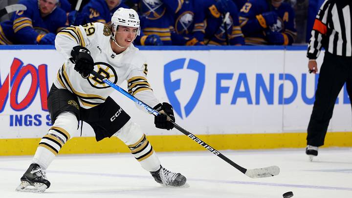 Sep 26, 2023; Buffalo, New York, USA;  Boston Bruins defenseman Frederic Brunet (59) makes a pass during the third period against the Buffalo Sabres at KeyBank Center. Mandatory Credit: Timothy T. Ludwig-USA TODAY Sports