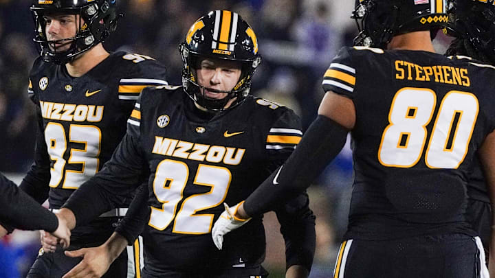Nov 18, 2023; Columbia, Missouri, USA; Missouri Tigers place kicker Harrison Mevis (92) is congratulated after kicking a field goal against the Florida Gators during the first half at Faurot Field at Memorial Stadium.