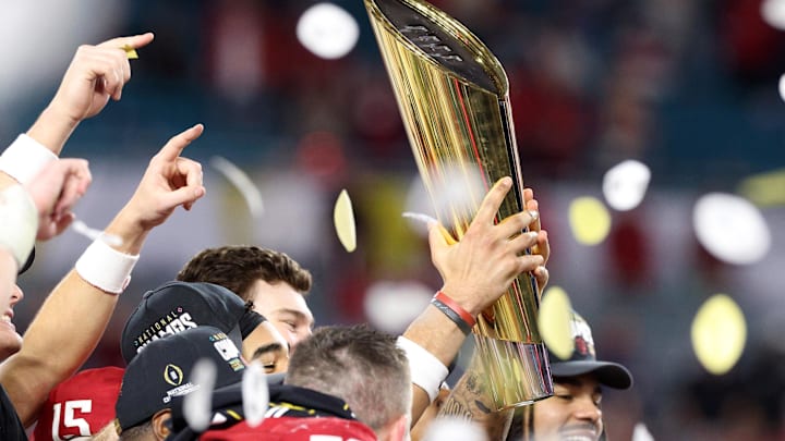 Jan 19, 2026; Miami Gardens, FL, USA; The Indiana Hoosiers players react with the trophy after the College Football Playoff National Championship game at Hard Rock Stadium.