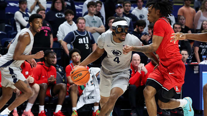 Penn State Nittany Lions guard Kayden Mingo (4) drives the ball towards the basket as Rutgers Scarlet Knights guard Jamichael Davis (1) defends during the first half at Bryce Jordan Center. 