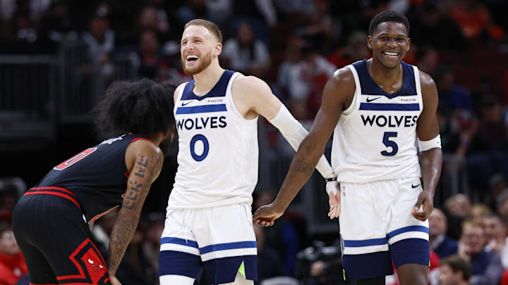 Nov 7, 2024; Chicago, Illinois, USA; Minnesota Timberwolves guard Anthony Edwards (5) and guard Donte DiVincenzo (0) react during the second half of a basketball game against the Chicago Bulls at United Center. Mandatory Credit: Kamil Krzaczynski-Imagn Images