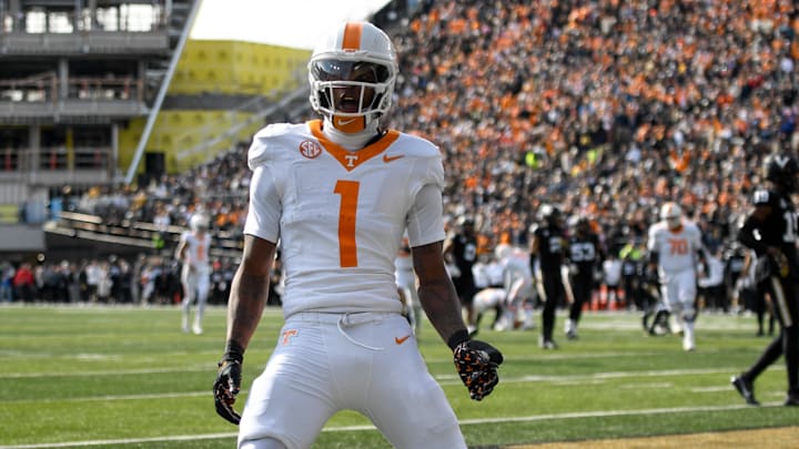 Nov 30, 2024; Nashville, Tennessee, USA;  Tennessee Volunteers wide receiver Dont'e Thornton Jr. (1) celebrates his touchdown with his teammates against the Vanderbilt Commodores during the first half at FirstBank Stadium. Mandatory Credit: Steve Roberts-Imagn Images
