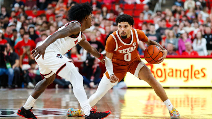 Dec 4, 2024; Raleigh, North Carolina, USA; Texas Longhorns guard Jordan Pope (0) dribbles with the ball during the second half of the game against the North Carolina State Wolfpack at Lenovo Center. Mandatory Credit: Jaylynn Nash-Imagn Images