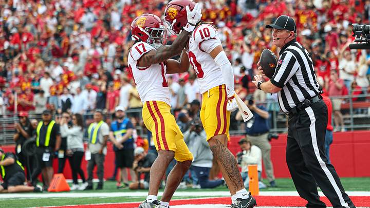 USC linebacker Deven Bryant (17) celebrates with receiver Corey Simms after the latter scored against Rutgers. USC linebacker Deven Bryant (17) celebrates with receiver Corey Simms after the latter scored against Rutgers.