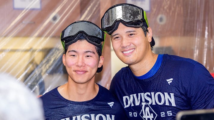 Sep 25, 2025; Phoenix, Arizona, USA; Los Angeles Dodgers designated hitter Shohei Ohtani (17) (right) and infielder Hyeseong Kim (6) (left) celebrate in the locker after winning the National League West championship follow a game against the Arizona Diamondbacks at Chase Field. Mandatory Credit: Allan Henry-Imagn Images