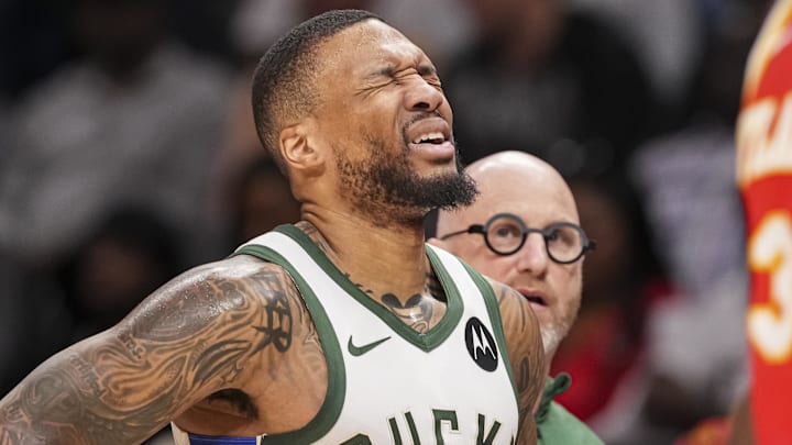 Mar 4, 2025; Atlanta, Georgia, USA; Milwaukee Bucks guard Damian Lillard (0) reacts after being injured against the Atlanta Hawks during the first half at State Farm Arena. Mandatory Credit: Dale Zanine-Imagn Images Mar 4, 2025; Atlanta, Georgia, USA; Milwaukee Bucks guard Damian Lillard (0) reacts after being injured against the Atlanta Hawks during the first half at State Farm Arena. Mandatory Credit: Dale Zanine-Imagn Images