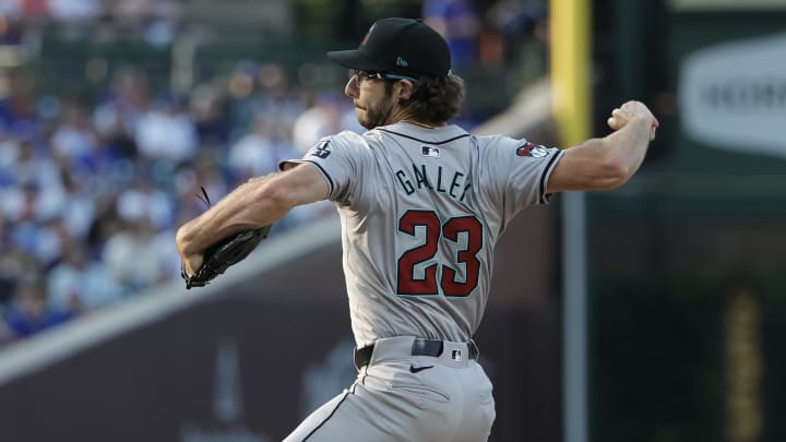 Jul 20, 2024; Chicago, Illinois, USA; Arizona Diamondbacks starting pitcher Zac Gallen (23) delivers against the Chicago Cubs during the first inning at Wrigley Field. Mandatory Credit: Kamil Krzaczynski-USA TODAY Sports