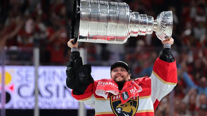 Jun 17, 2025; Sunrise, Florida, USA; Florida Panthers goaltender Sergei Bobrovsky (72) hoists the Stanley Cup after winning game six of the 2025 Stanley Cup Final against the Edmonton Oilers at Amerant Bank Arena. Mandatory Credit: Sam Navarro-Imagn Images Jun 17, 2025; Sunrise, Florida, USA; Florida Panthers goaltender Sergei Bobrovsky (72) hoists the Stanley Cup after winning game six of the 2025 Stanley Cup Final against the Edmonton Oilers at Amerant Bank Arena. Mandatory Credit: Sam Navarro-Imagn Images