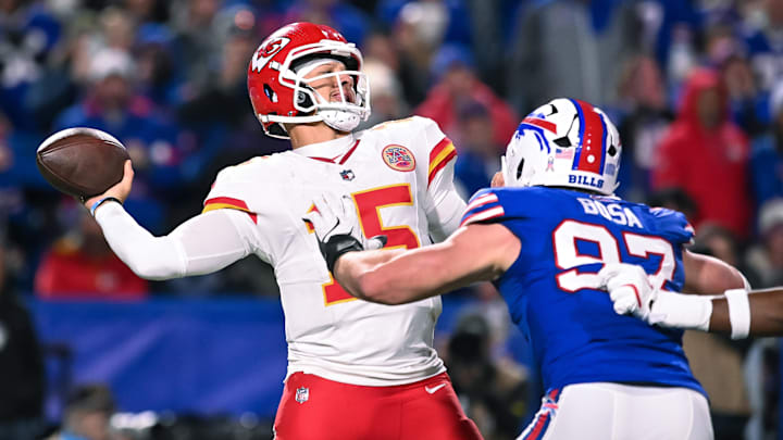 Nov 2, 2025; Orchard Park, New York, USA; Kansas City Chiefs quarterback Patrick Mahomes (15) throws a pass under pressure from Buffalo Bills defensive end Joey Bosa (97) in the fourth quarter at Highmark Stadium. 